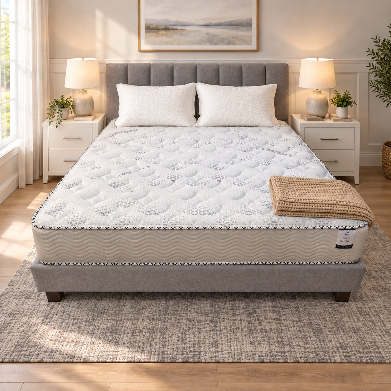 RV King Breeze Cool Max 10" Medium Firm Tight top mattress on a gray upholstered bed with two white pillows and a tan knit throw, in a bedroom with white nightstands, table lamps and a framed landscape print