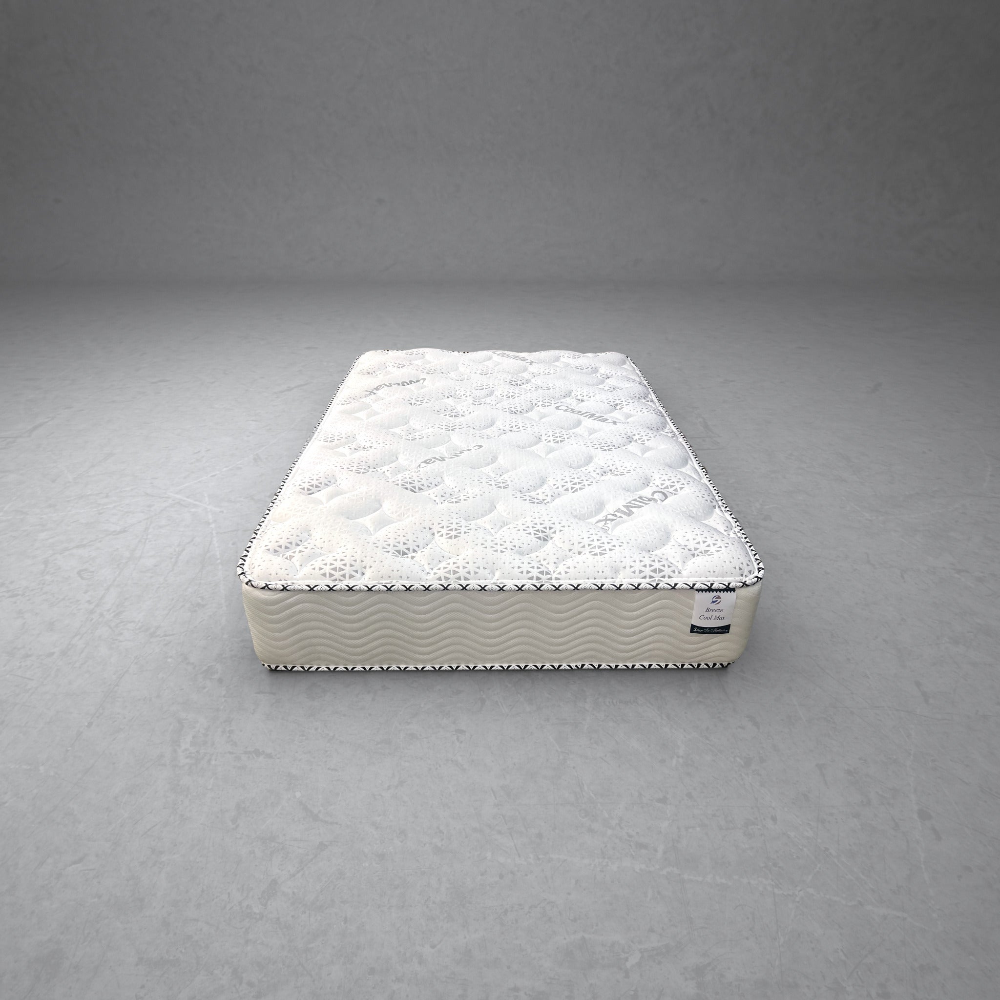 Three Quarter Breeze Cool Max 10" Medium Firm Tight top mattress on a concrete background